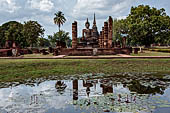 Thailand, Old Sukhothai - Wat Mahathat, the remains of a bot with a large seated Buddha. 